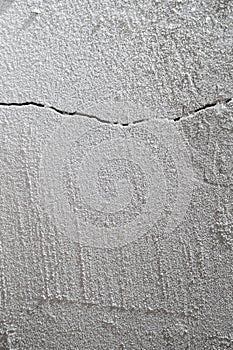 Crack in cement floor from shrinkage of house photo