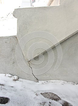 Crack in concrete stairs in winter