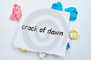 Crack of dawn - english idiom hand lettering on wooden blocks