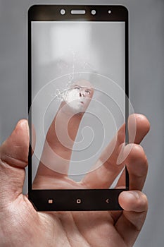 Crack on the glass from over-tapping the screen by the user. the human face is pressed against the glass of the phone.screen is