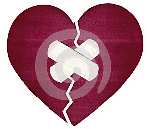 A crack in the heart taped over with a band-aid, a symbol of reconnected hearts