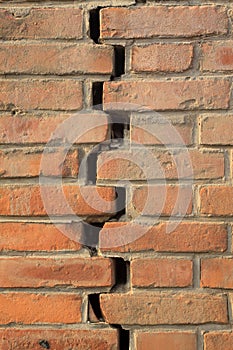 Crack of red brick wall