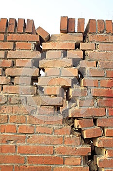 Crack of red brick wall