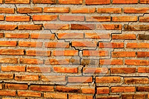 The crack wall from brick and brick background, red crack brick and pattern of crack brick wall background