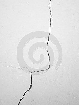 Crack on white wall background