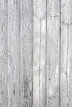 Cracked aged surface vertical white painted wooden planks texture background backdrop