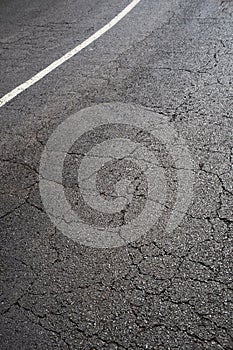 cracked asphalt road cracks, white lane street texture pavement