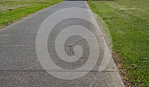 Cracked asphalt on walking path