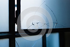 Cracked blue glass window conceptual creative photo