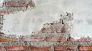 Cracked brick and concrete wall. Old bricks wall and cement. Texture of brick wall pattern background. Abstract wallpaper texture