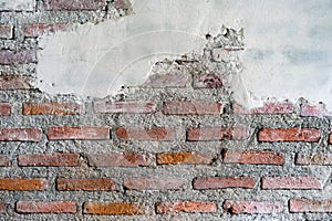 Cracked brick and concrete wall. Old bricks wall and cement. Texture of brick wall pattern background. Abstract wallpaper texture