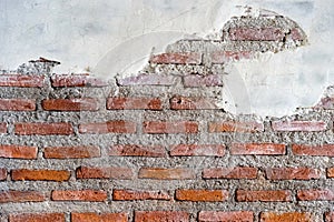 Cracked brick and concrete wall. Old bricks wall and cement. Texture of brick wall pattern background. Abstract wallpaper texture