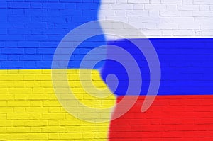 Cracked Brick Wall With Painted Russia And Ukraine Flags