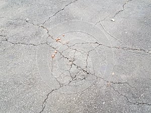 Cracked or broken black asphalt or pavement