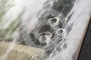 Cracked broken car windshield. Smashed windscreen of a car, damaged glass