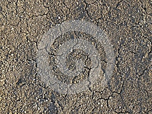 Cracked dry ground mud, dried under sun road