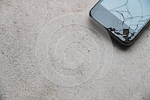 Cracked cell phone on the floor