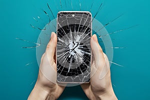 Cracked cell phone symbolizes modern frustration and technological fragility