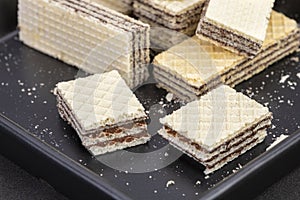 Cracked chocolate filled wafers, wafer bar slices, long cut biscuit sticks