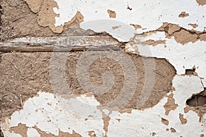 Cracked clay wall. Old plaster