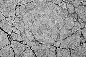 Cracked concrete floor texture background.
