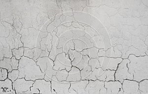 Cracked concrete grey wall covered with gray cement texture as background can be used in design. Dirty concrete texture