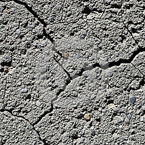 Cracked concrete surface with a rough,