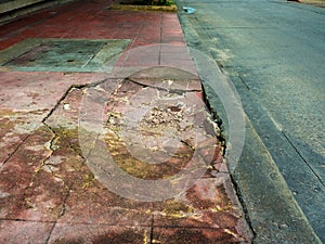Damaged cements footpath.