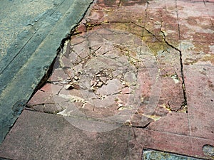 Damaged cements footpath.
