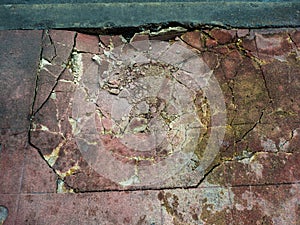 Damaged cements footpath.