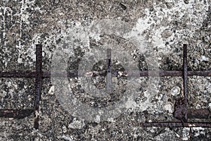 Cracked damaged concrete with old rusty steel rod