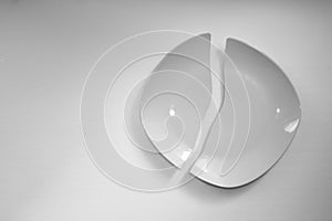 Cracked dish on the white background