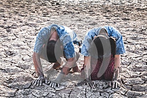 The cracked dry ground due to drought.