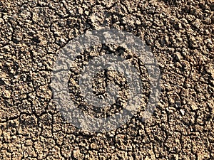 Cracked dry ground mud, dried under sun road