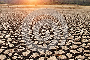 Cracked earth from arid drought weather in dam or river. , surface clay soil rough crack pattern texture background, desert broken