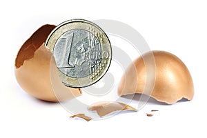 Cracked egg with Euro coin