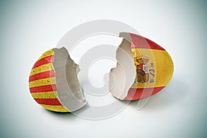 Cracked eggshell with Catalan and Spanish flags