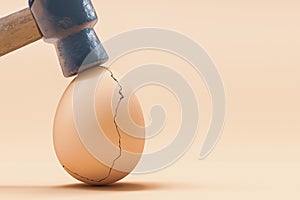 Cracked eggshell hit by hammer