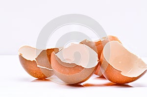 Cracked eggshell on white background