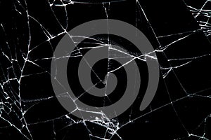 Cracked glass isolated on a black background.