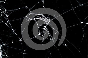 Cracked glass isolated on a black background.