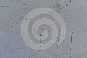 Cracked gray stucco background. Texture.