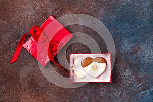 Cracked heart shaped cookie decorated with icing as a concept of broken heart, breakup and end of relationship