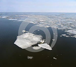 Cracked ice floes on a frozen sea.