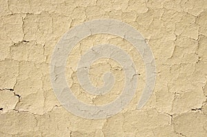 Cracked mud plaster wall closeup