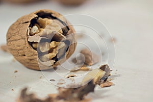 Cracked nut  on a wood background