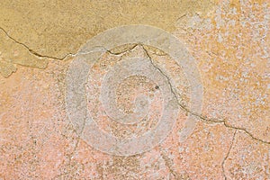 Cracked orange wall background.