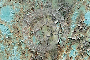 Cracked and peeled paint on the iron surface