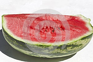 Cracked piece of fresh juicy watermelon.Natural bright light