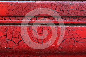 Cracked red paint on grunge metal surface - macro 10